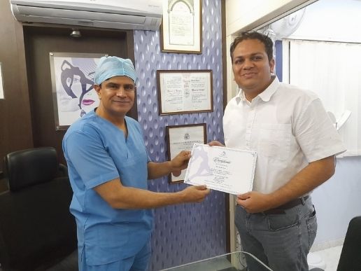 Dr. Ashish providing certificate